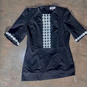 Nanette tailored black shirt with lace trim on bodice and cuffs, size 10.